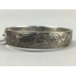 AN ENGRAVED SILVER BANGLE AND BRACELETS