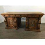 AN EARLY 20TH CENTURY CARVED OAK DESK