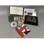 A BOX OF COIN COVERS AND COIN SETS