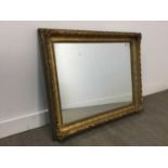 A MOULDED GILT WOOD AND GESSO WALL MIRROR