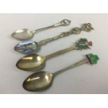 A GROUP OF SILVER AND PLATED SOUVENIR SPOONS