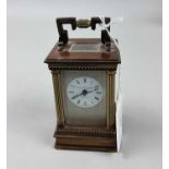 A CARRIAGE CLOCK AND A SAND TIMER