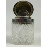 A LATE VICTORIAN SILVER MOUNTED CUT GLASS PERFUME BOTTLE