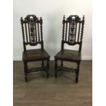 A PAIR OF EARLY 20TH CENTURY CARVED OAK HALL CHAIRS