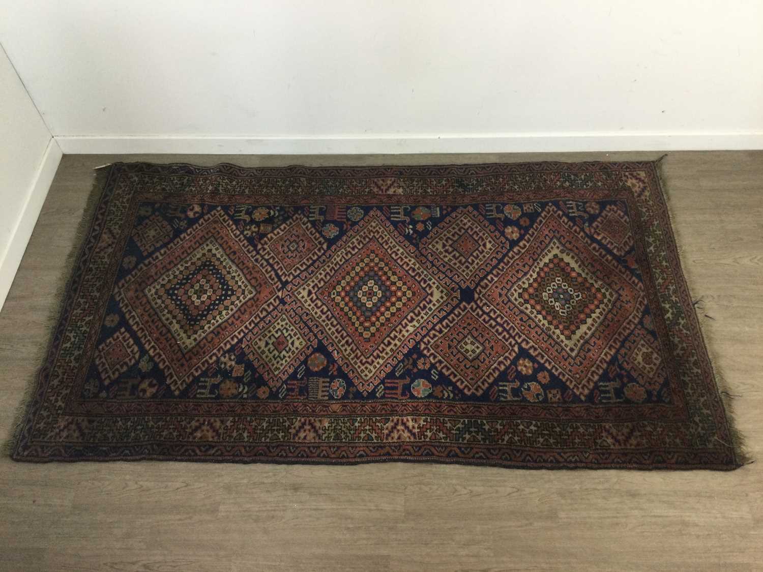 A PERSIAN RUG AND ANOTHER RUG