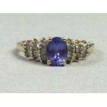 A TANZANITE AND DIAMOND RING