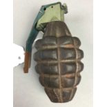 A REPRODUCTION GERMAN HAND GRENADE AND A FRAG GRENADE