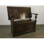 AN EARLY 20TH CENTURY OAK MONKS BENCH