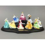 A GROUP OF ELEVEN MINIATURE ROYAL DOULTON FIGURES