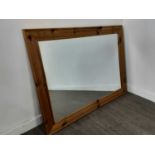 A PINE FRAMED WALL MIRROR