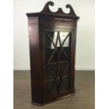 A GEORGIAN MAHOGANY CORNER CABINET