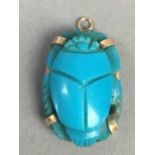 A TURQUOISE SCARAB PENDANT ALONG WITH AN EMERALD AND DIAMOND PENDANT