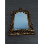 A WALL MIRROR IN GILT FRAME AND OTHER MIRRORS