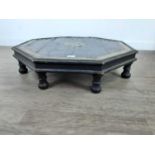 AN OCTAGONAL LOW TABLE