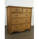 AN OAK CHEST OF DRAWERS
