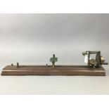 A 19TH CENTURY BRASS YARN TESTER