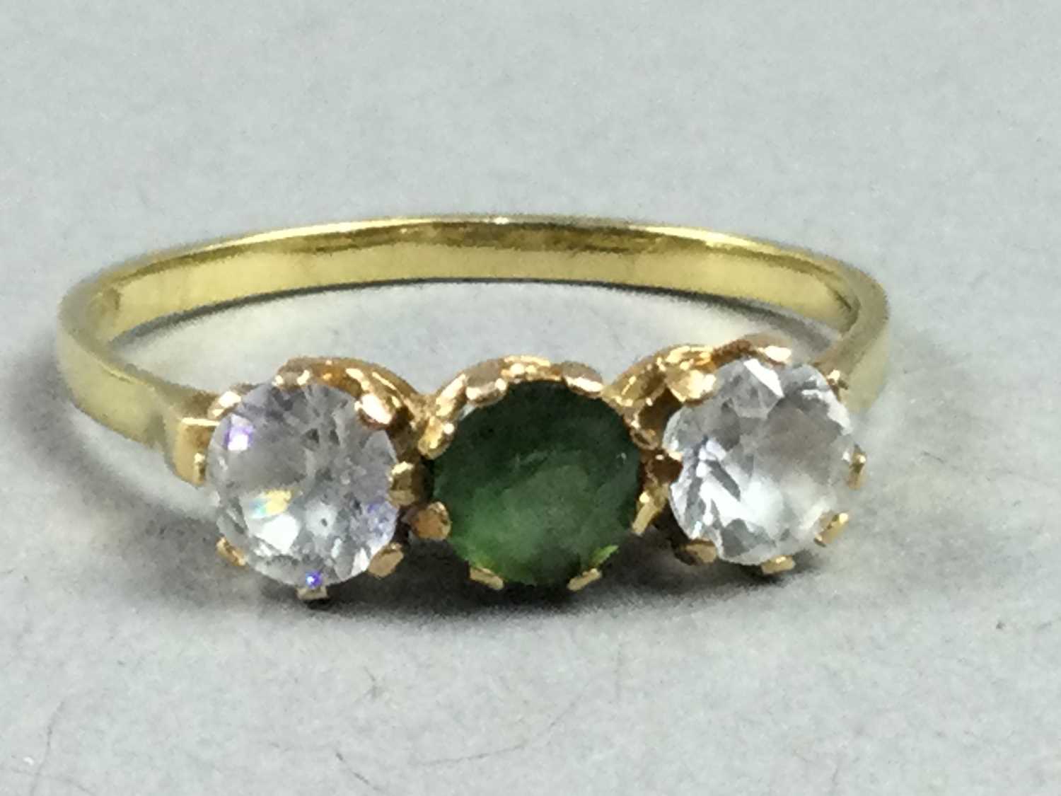 A GREEN AND WHITE GEM SET RING