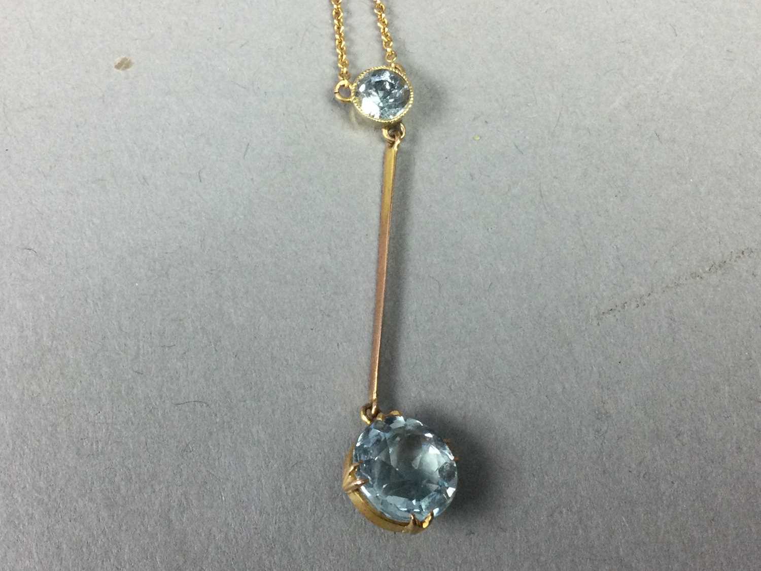 TWO BLUE GEM SET PENDANTS