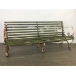 A PAIR OF WROUGHT IRON AND WOODEN SLATTED GARDEN BENCHES