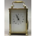 A DOMINIUM BRASS CARRIAGE CLOCK AND ANOTHER CLOCK