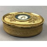 AN OVAL GILTMETAL TRINKET BOX, A CIRCULAR BOX AND A POCKET WATCH