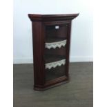 A SMALL MAHOGANY HANGING CORNER CUPBOARD