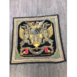 AN INDIAN EMBROIDERED CREST PANEL