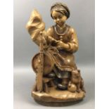 A CARVED BLACK FOREST FIGURE AND A SWISS MUSICAL BOX