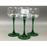 A SET OF EIGHT GREEN STEMMED HOCK GLASSES AND OTHER GLASS WARE