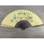 A LARGE CHINESE DECORATED FAN AND THREE OTHERS