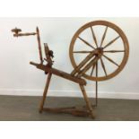 A LARGE OAK SPINNING WHEEL