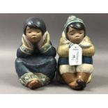 A PAIR OF LLADRO FIGURES OF BOY AND GIRL PENSIVE ESKIMOS