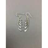A GROUP OF SILVER EARRINGS