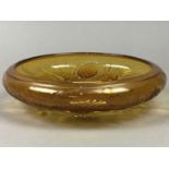 AN ART DECO PRESSED AMBER GLASS BOWL, FIGURE OF A DANCER AND A HIP FLASK