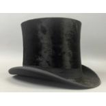 A TOP HAT, BOWLER HAT AND WHIP