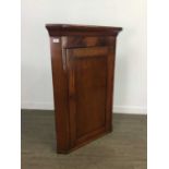 A GEORGIAN MAHOGANY CORNER CUPBOARD