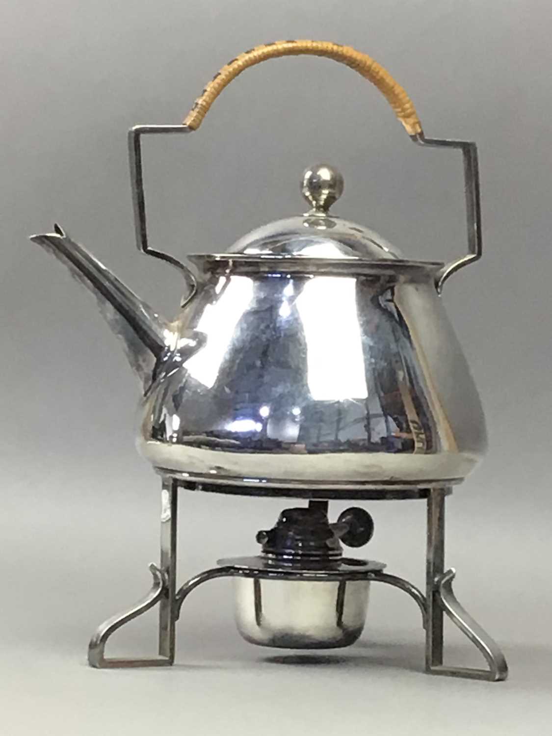 AN ARTS & CRAFTS SILVER PLATED KETTLE ON STAND