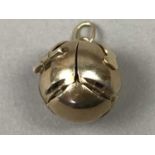 A SILVER GILT MASONIC BALL PENDANT