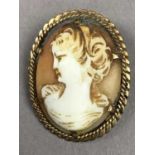 A NINE CARAT GOLD CAMEO PENDANT AND OTHER BROOCHES