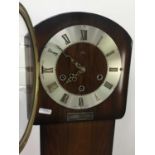 A WALNUT GRANDMOTHER CLOCK