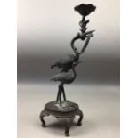 A JAPANESE BRONZED SPELTER CANDLESTICK