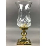 A WATERFORD CRYSTAL AND BRASS CANDLESTICK