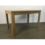 A MODERN OAK EFFECT DINING TABLE AND FOUR CHAIRS