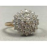 A NINE CARAT GOLD DIAMOND CLUSTER RING