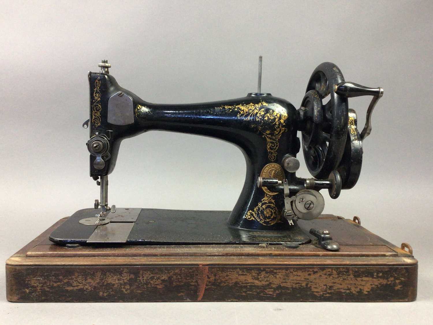 A VINTAGE SINGER PORTABLE SEWING MACHINE