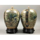 A PAIR OF JAPANESE SATSUMA URNS AND COVERS