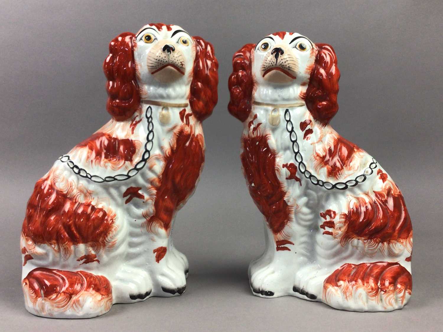 A PAIR OF VICTORIAN STONEWARE WALLY DOGS