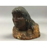 A RESIN CARVING OF A WOMAN AND CHILD