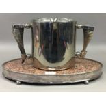 A GRANITE AND SILVER PLATED SERVING BOARD, ALONG WITH AN ICE BUCKET