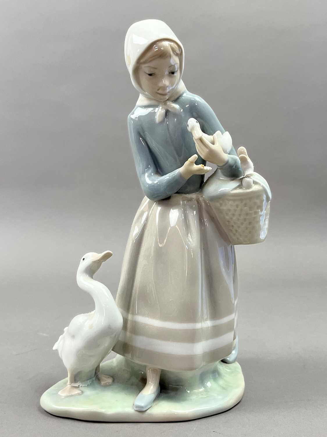 A LLADRO FIGURE OF A GIRL WITH GEESE AND OTHER FIGURES